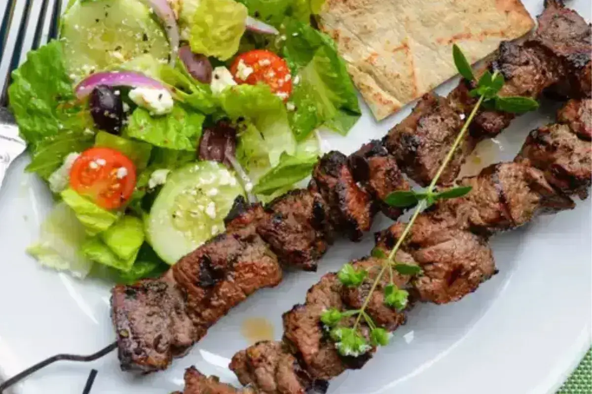 Greek-style grilled lamb souvlaki skewers with tzatziki sauce