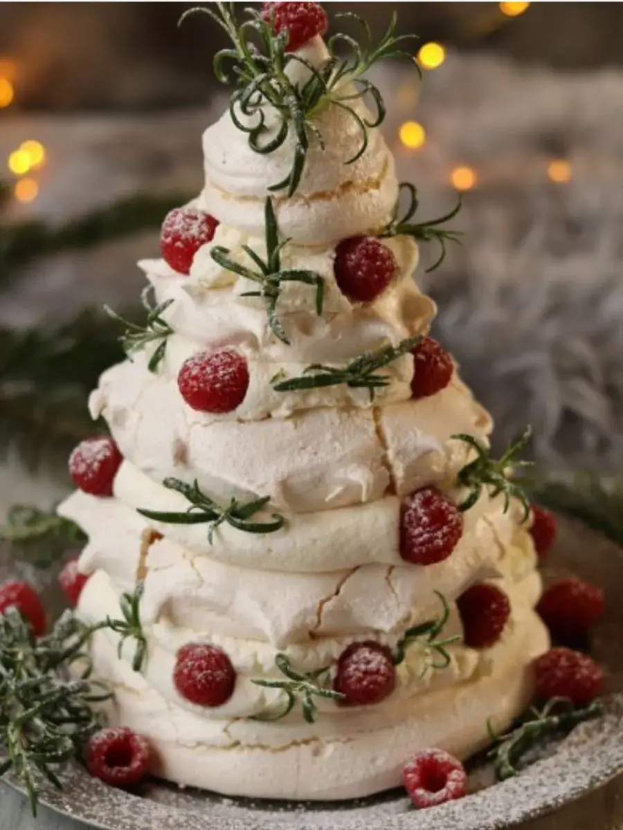 Festive Pavlova Christmas Tree with berries and whipped cream